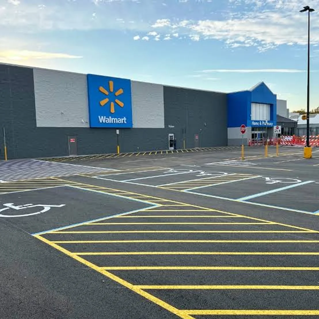 Freshly striped ADA stalls and crosshatch in front of a Walmart store